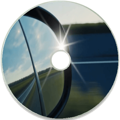 Reflective CD image showing a scenic view from a car side mirror.